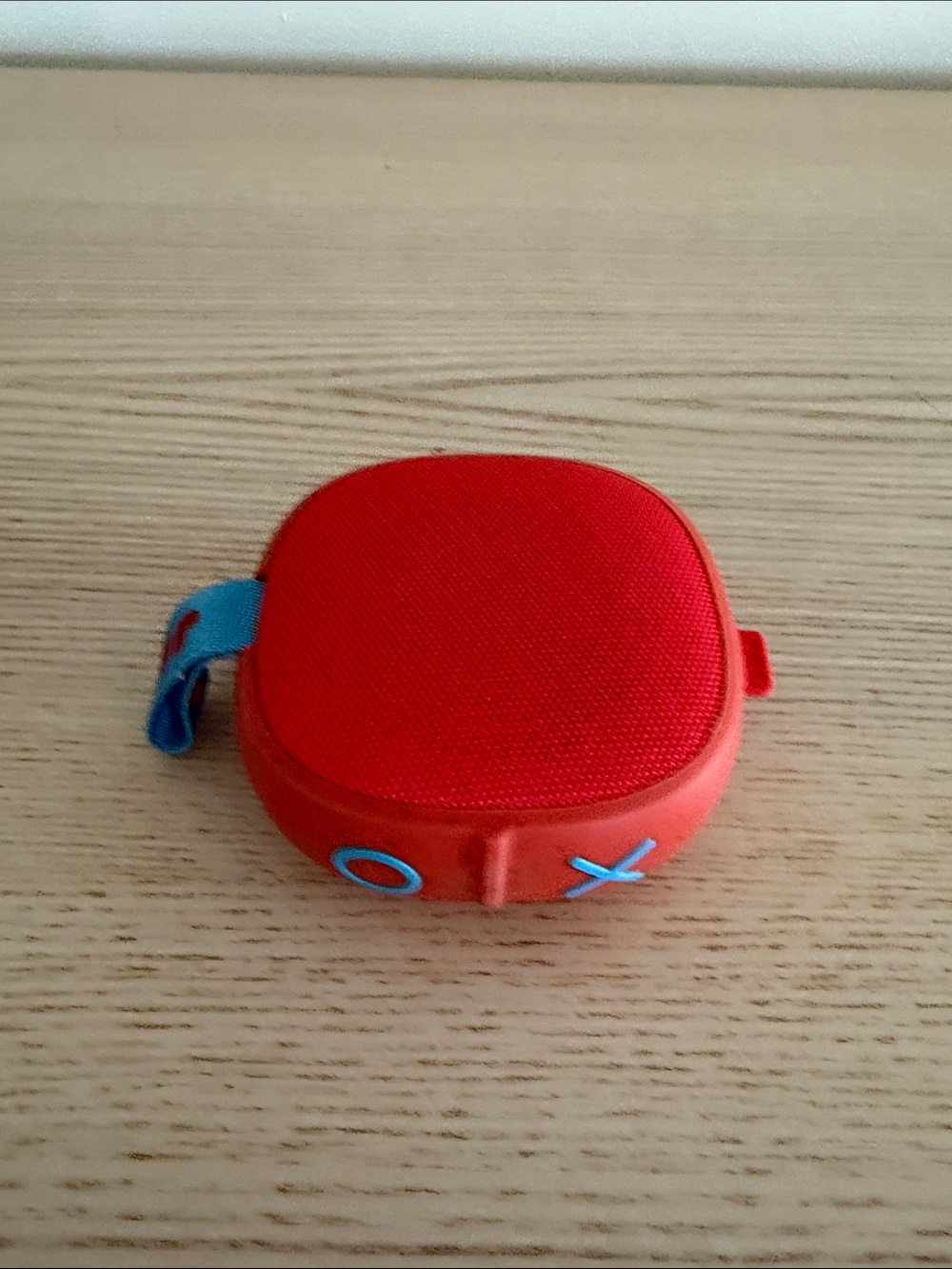 Portable Red Bluetooth Speaker with Blue Accents